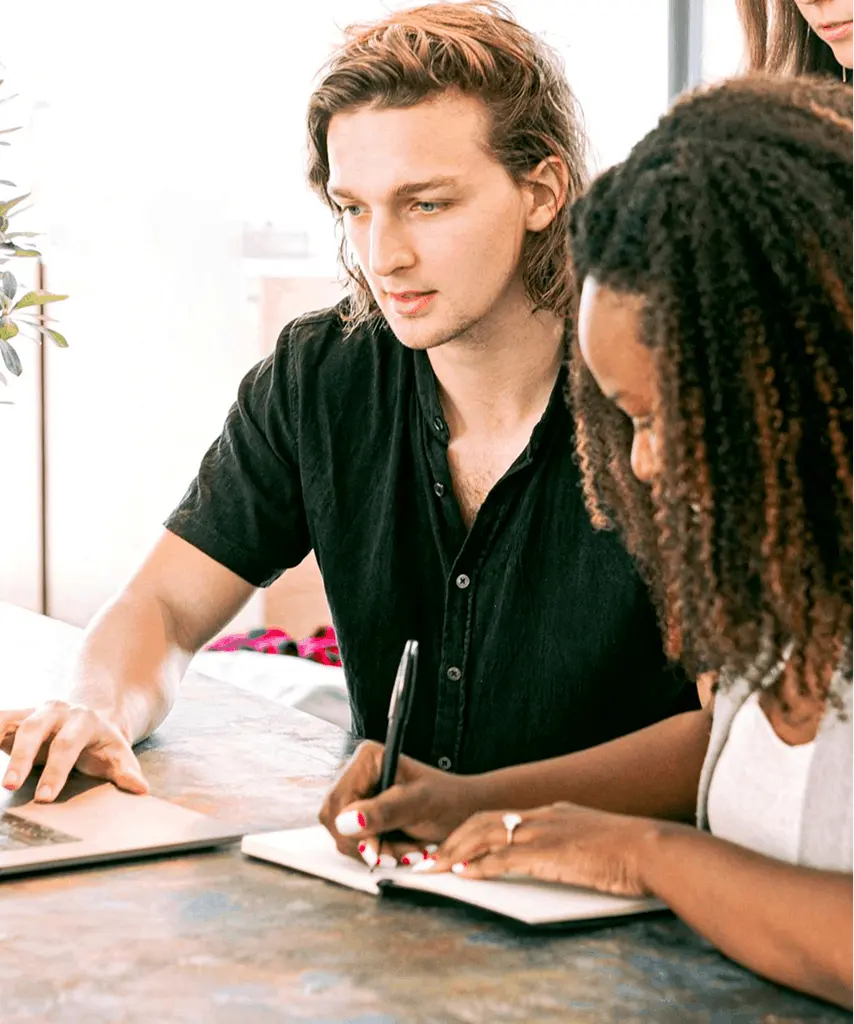 Marketing professionals discussing campaign strategy in a collaborative workspace