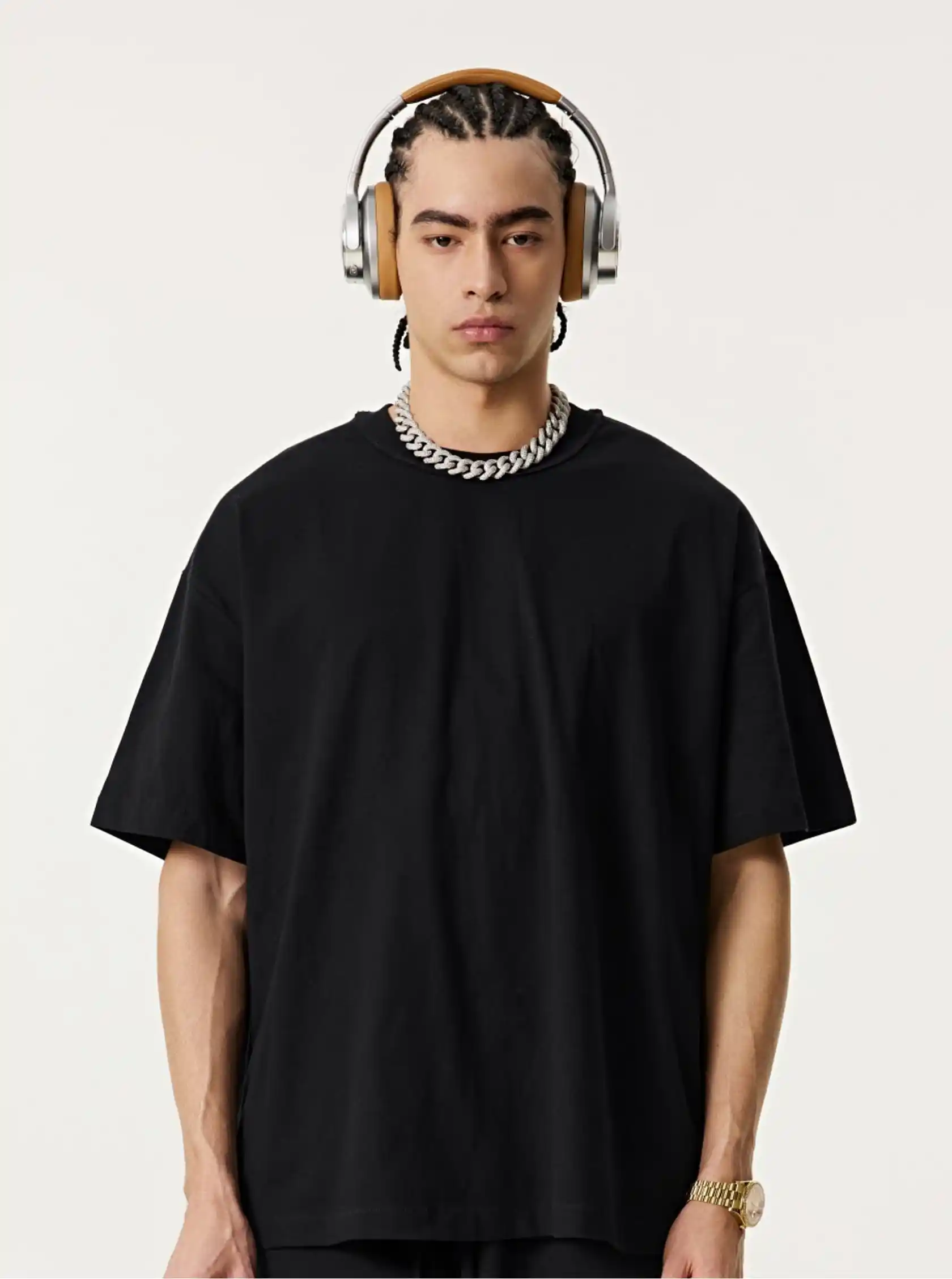 A man picked out a plain black T-shirt and waited to start make custom apparel he wanted